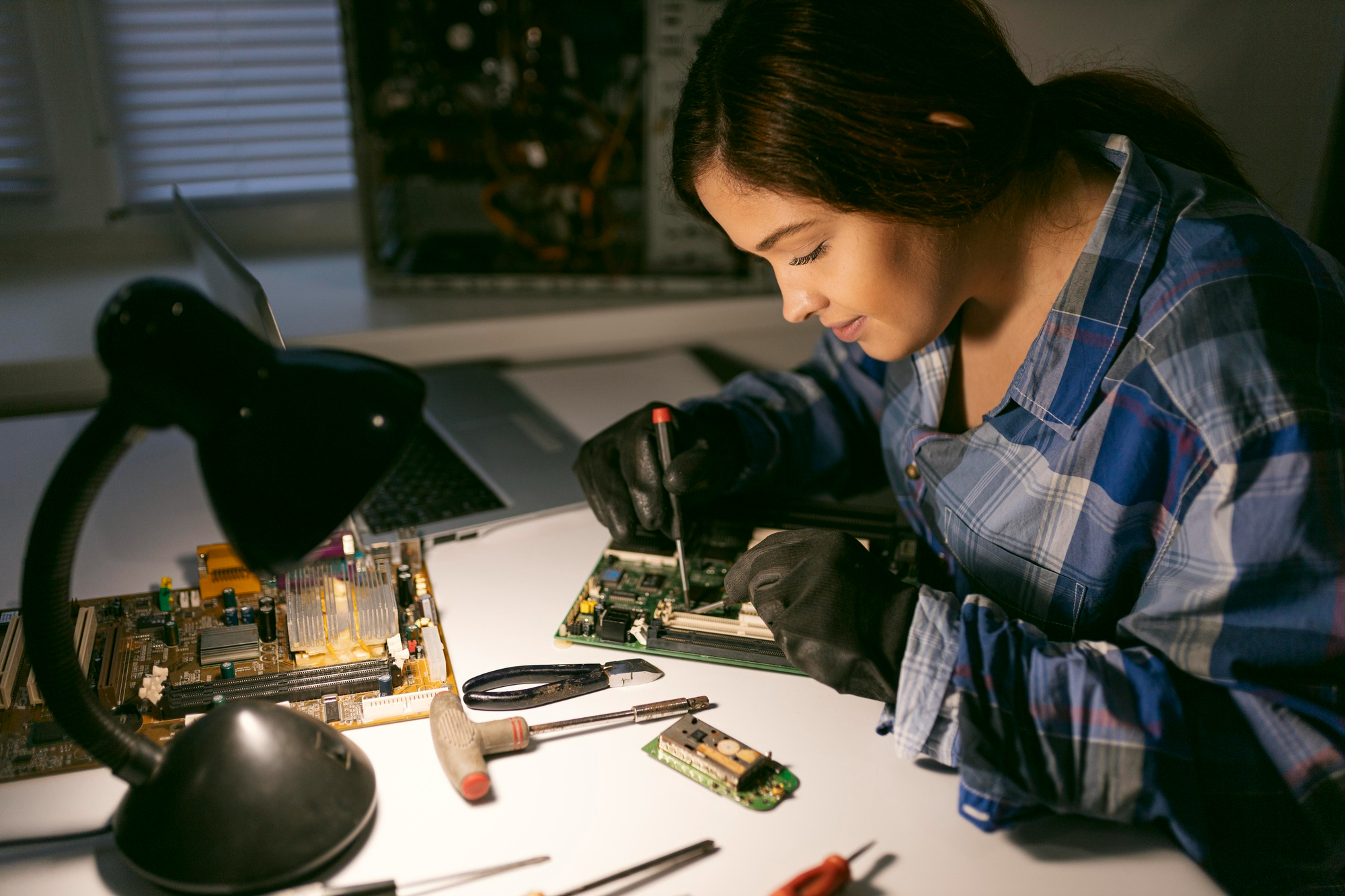 Engineer inspecting a PCB